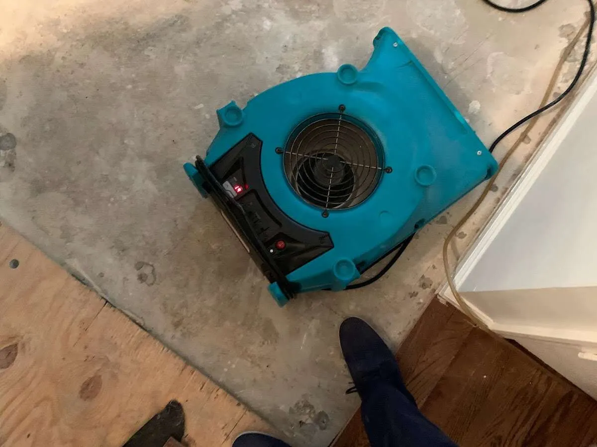 Air mover drying subfloor during Leak Detection & Repair in Miami Beach